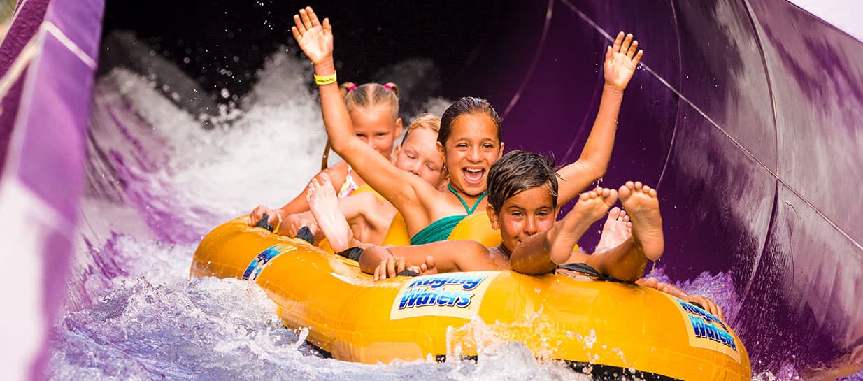Group of children riding the Aqua Rocket slide