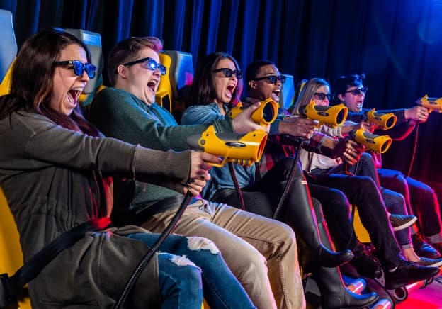 Group of adults on the XD Dark ride screaming