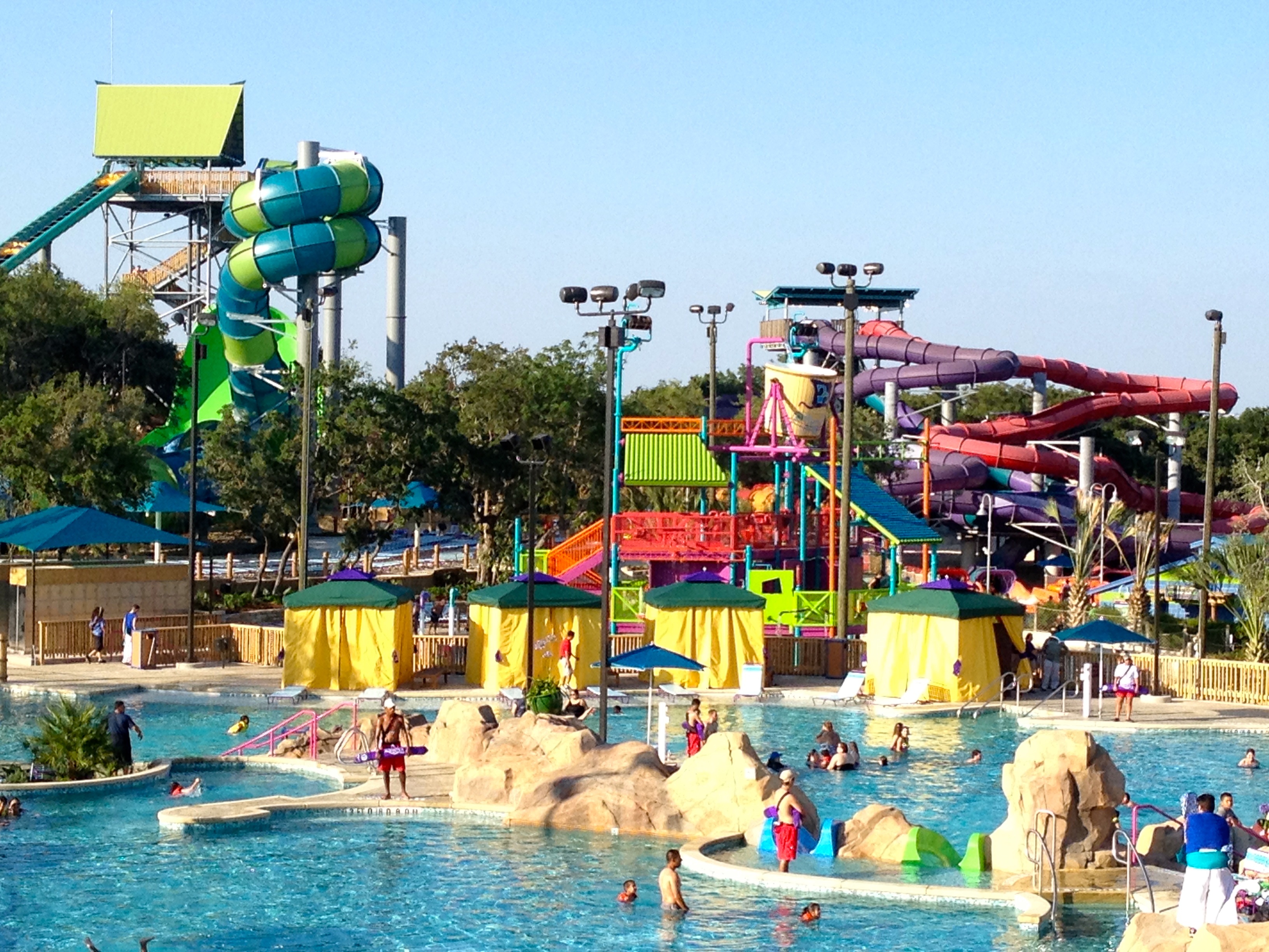 Colorful water slide towers above the pool at Aquatica water park